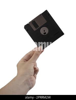 an old floppy disk in the female hand on a transparent background Stock Photo
