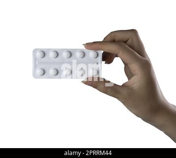 a blister pack of pills in the female hand on a transparent background Stock Photo