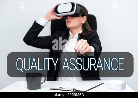 Sign displaying Quality AssuranceEnsures a certain level of quality Established requirement. Concept meaning Ensures a certain level of quality Established requirement Stock Photo