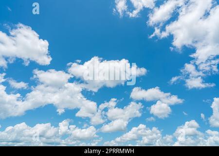 Beautiful blue sky and white cumulus clouds abstract background. Cloudscape background. Blue sky and fluffy white clouds on sunny day. Nice weather. Beauty cumulus cloudscape. Summer sky weather. Stock Photo
