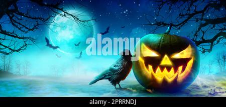 Horror background with scary crow in the darkness Stock Photo