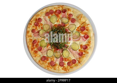 Top view of pizza with sausage, ham and bacon decorated with fried green onion Stock Photo