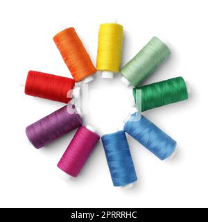 Frame of different colorful sewing threads on white background, top view. Space for text Stock Photo