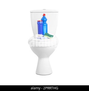 Different cleaning supplies on toilet bowl against white background Stock Photo