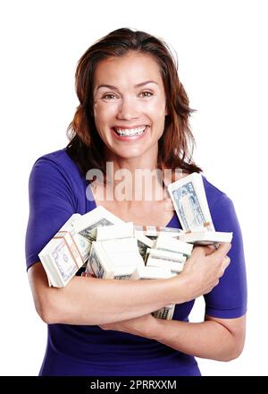 Im a winner. Studio portrait of a woman in her mid-30s smiling widely while holding stacks of paper currency. Stock Photo