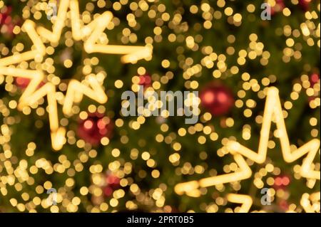 Blur bokeh background of star shaped Christmas tree lights Stock Photo