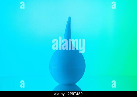 front view bulb syringe aspirator on sky blue background Stock Photo