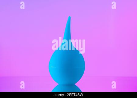 front view bulb syringe aspirator on pink background Stock Photo