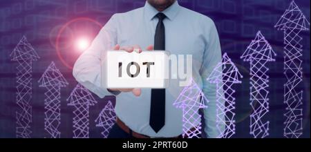 Hand writing sign Iot, Internet Concept internet of things transfer data to network without need humantohuman Stock Photo