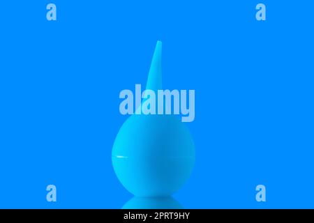 front view bulb syringe aspirator on blue background Stock Photo