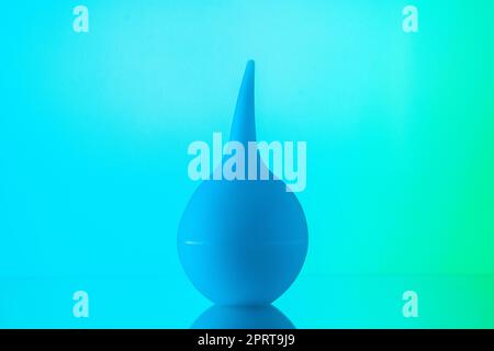 front view bulb syringe aspirator on sky blue background Stock Photo