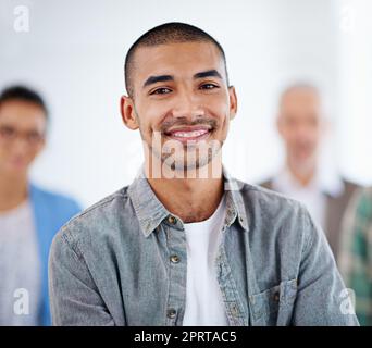 I know where Im going. Proud looking young man with people in the background. Stock Photo