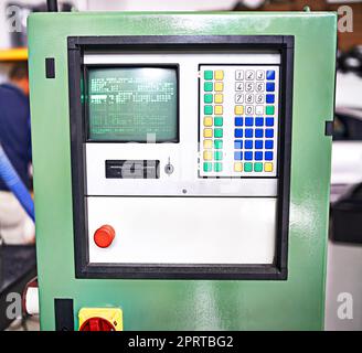 Its in perfect working condition. Closeup shot of a control panel on a piece of factory machinery. Stock Photo