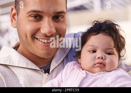 My little bundle of love and joy. a father cradling his little baby girl. Stock Photo