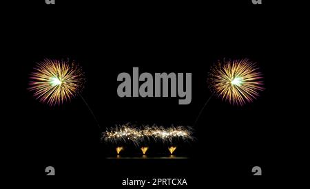 Beautiful fireworks display on black sky with copy space for greeting text. Celebration and anniversary concept Stock Photo