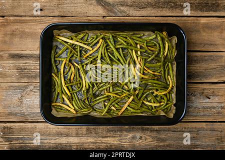 Green beans baked in oven Stock Photo