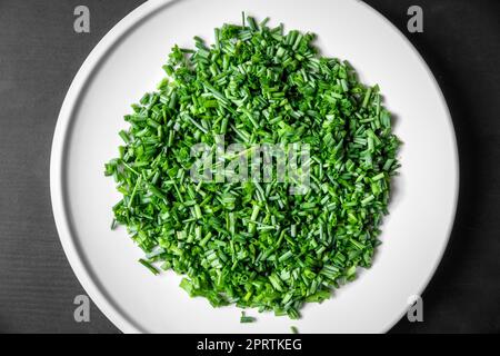 Fresh cut chives on a plate Stock Photo