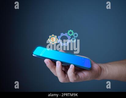 Gear icon and phone propose an idea Assistance and Technical support concept of maintenance,setup,repair . Stock Photo