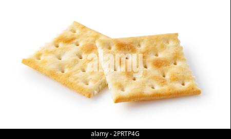 Two crackers placed on a white background. Stock Photo