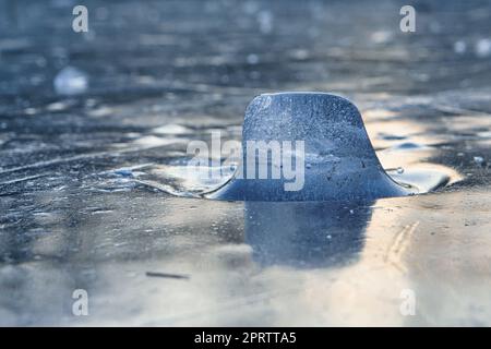Ice pieces on a lake at sunset in winter atmosphere Stock Photo