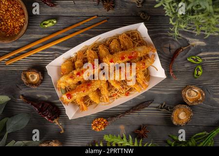 Shrimp tempura with sweet chili sauce served with noodles Stock Photo