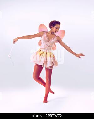 Dance of the fairy. A full length shot of a cute fairy dancing. Stock Photo