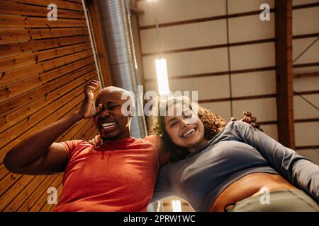 Low angle view of happy female athletes having fun at sports court Stock Photo