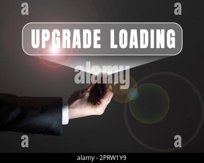 Conceptual display Upgrade Loading, Business concept advancement of applications to more improved tools Businessman in suit holding notepad symbolizin Stock Photo