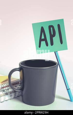 Text showing inspiration Api, Word for set of routines, protocols, and tools for building software applications Notebook With Important Message On Des Stock Photo