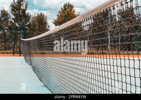 Playground with rubber coating, net and markings for tennis Stock Photo