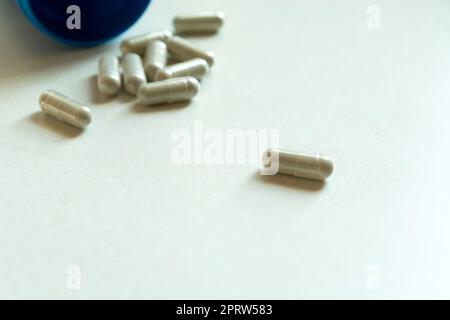 Close up of pills in capsules on a countertop Stock Photo
