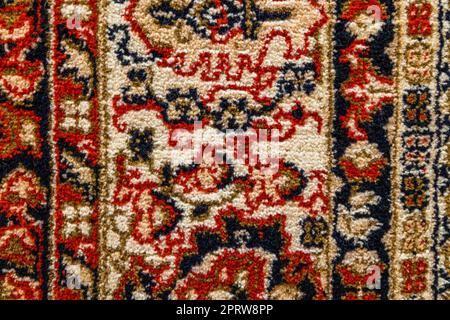 Part of old vintage carpet texture with abstract ornament Stock Photo