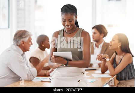 Tablet and business woman with solution, leadership and company goal for success. Happy smile of manager in a team building discussion working on people management strategy on a planner software app Stock Photo