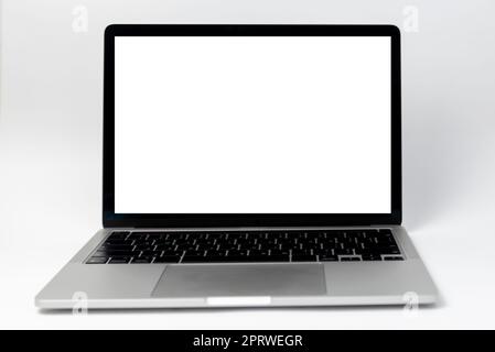 laptop computer frame with isolated white background blank screen. template presentation and advertisement. Stock Photo