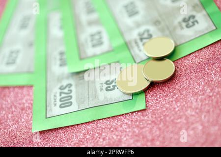 Close up view of green lottery scratch cards. Many used fake instant lottery tickets with gambling results. Gambling addiction concept. Stock Photo