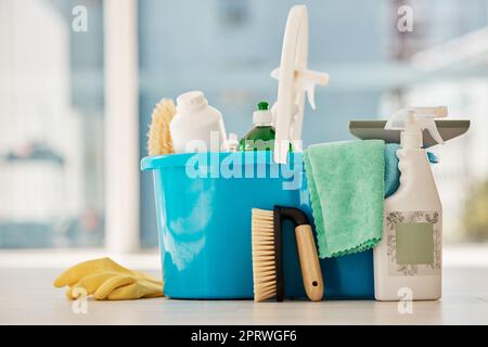 Cleaning, products and house service with container tools or chemical liquid cleaner in house, home interior. Service work, spring clean or housekeeping with plastic bottle, spray and brush in toilet Stock Photo