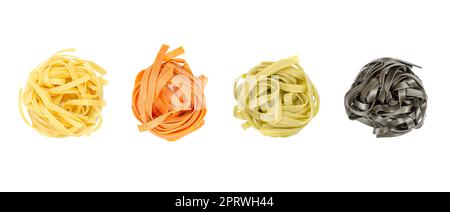 Tagliatelle pasta in different colors, twisted into nests, from above Stock Photo