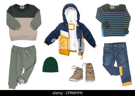 Collage set of little boys autumn clothes isolated on a white background. Denim trousers, jogging clothes, sneaker, a down jacket, shirts and a cap for child boy. Children's spring fashion. Stock Photo