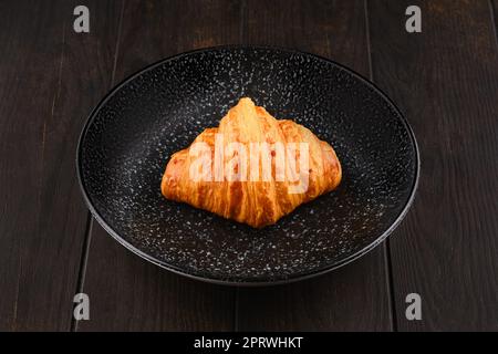 Freshly baked croissant on a plate Stock Photo