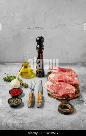 Raw lamb leg steak on cutting board Stock Photo