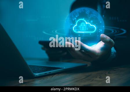 Businessman working Cybersecurity hologram with glowing lock icons on the virtual screen.Business technology internet and networking concept Stock Photo