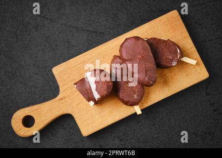 Overhead view of homemade curd bars in chocolate Stock Photo