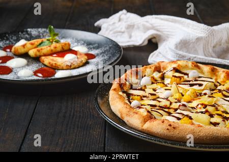 Sweet pie with banana, orange, cranberry and caramel syrup Stock Photo