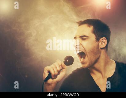 Young man singing rock Stock Photo