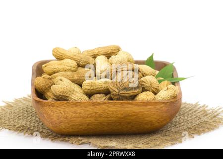 walnuts and peanuts in a bowl Stock Photo