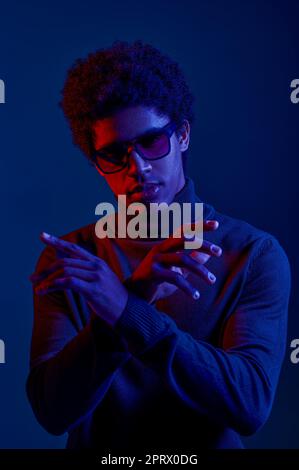 Young confident man posing for camera studio shot Stock Photo