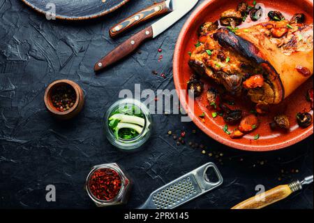 Appetizing baked pork leg Stock Photo