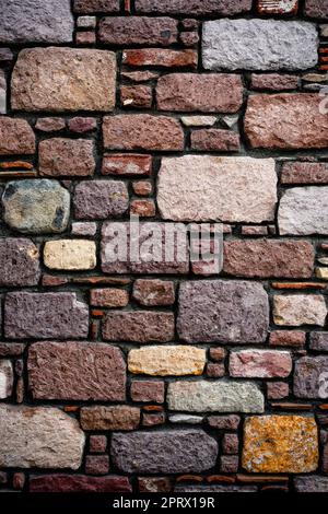 Vertical shot of stone tiles wall Stock Photo