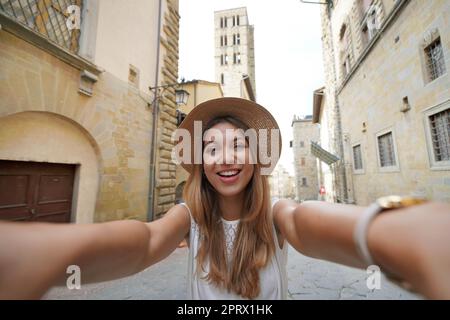Self portrait of beautiful tourist girl in the historic town of Arezzo, Tuscany, Italy Stock Photo