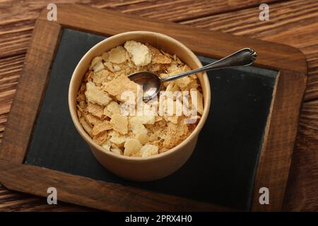 Brown paper cup of mille feuille custard cake Stock Photo
